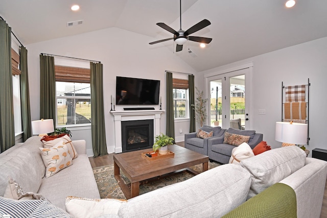 317 Encampment Blvd, Simpsonville, SC 29681 - living room with wood finished floors, a glass covered fireplace, lofted ceiling, visible vents, and ceiling fan