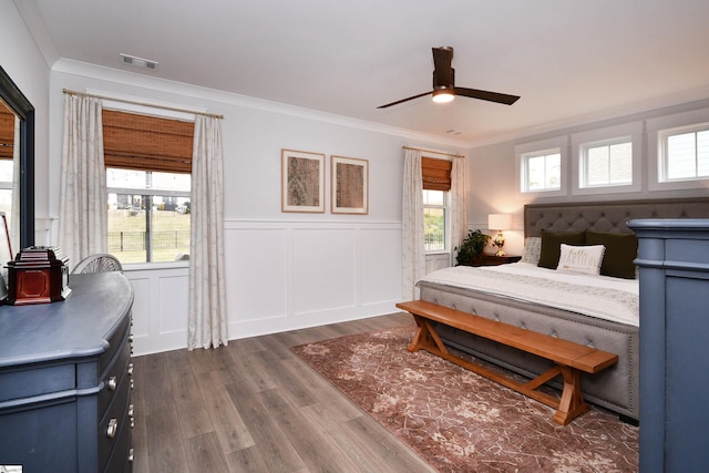 317 Encampment Blvd, Simpsonville, SC 29681 - bedroom with dark wood-style floors, visible vents, multiple windows, and ornamental molding