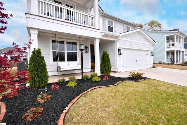 317 Encampment Blvd, Simpsonville, SC 29681 - view of front of property with cooling unit, concrete driveway, a balcony, a front yard, and a garage