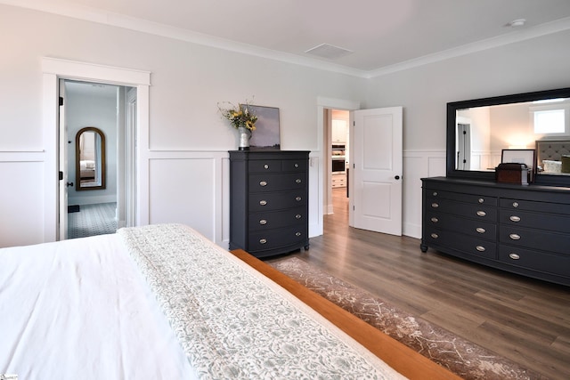 317 Encampment Blvd, Simpsonville, SC 29681 - bedroom with a decorative wall, visible vents, ornamental molding, dark wood finished floors, and wainscoting