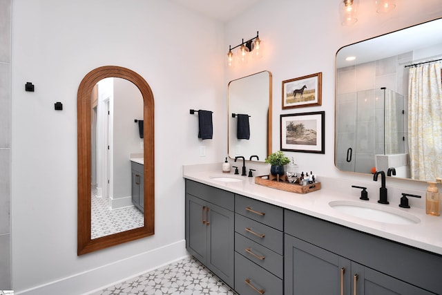 317 Encampment Blvd, Simpsonville, SC 29681 - bathroom with double vanity, a sink, a stall shower, and tile patterned floors