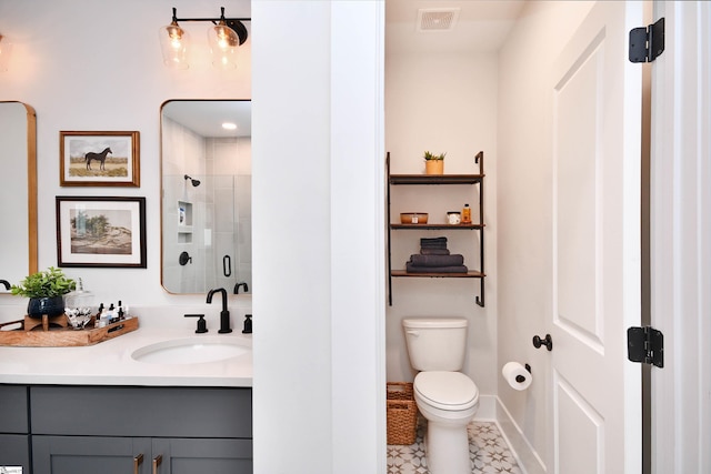 317 Encampment Blvd, Simpsonville, SC 29681 - full bathroom featuring visible vents, a shower stall, baseboards, toilet, and vanity