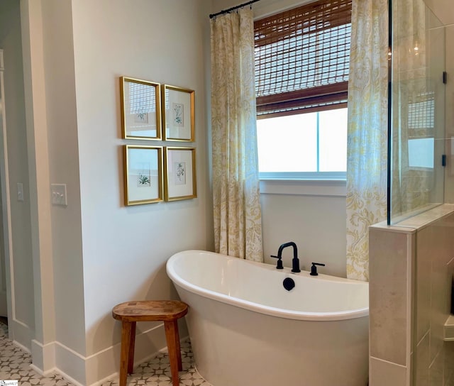 317 Encampment Blvd, Simpsonville, SC 29681 - full bath with a freestanding bath and baseboards