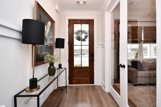 317 Encampment Blvd, Simpsonville, SC 29681 - entryway featuring visible vents, wood finished floors, and ornamental molding