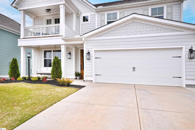 317 Encampment Blvd, Simpsonville, SC 29681 - view of front of home featuring a balcony, driveway, a front lawn, a porch, and a garage