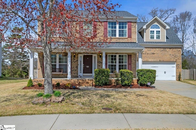 513 Rio Grande Pl, Simpsonville, SC 29680 - view of front of property with roof with shingles, concrete driveway, a front lawn, and brick siding