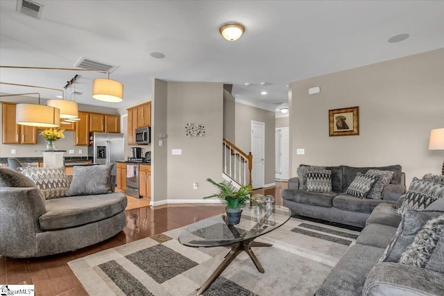 513 Rio Grande Pl, Simpsonville, SC 29680 - living area with visible vents, light wood-style flooring, baseboards, and stairs