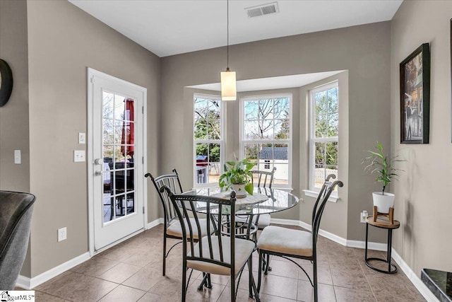 513 Rio Grande Pl, Simpsonville, SC 29680 - dining room with tile patterned floors, a healthy amount of sunlight, baseboards, and visible vents