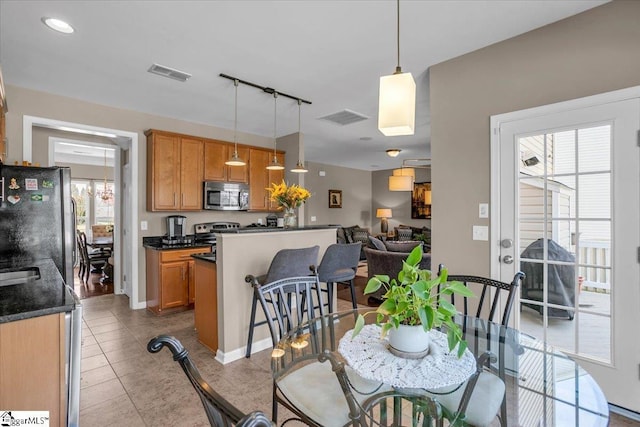 513 Rio Grande Pl, Simpsonville, SC 29680 - dining space with track lighting, light tile patterned floors, and visible vents