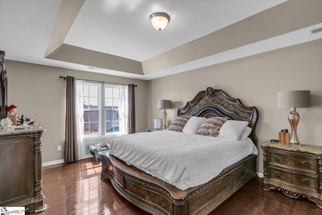 513 Rio Grande Pl, Simpsonville, SC 29680 - bedroom with dark wood-type flooring, visible vents, baseboards, and a raised ceiling