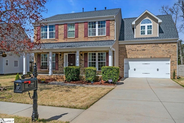 513 Rio Grande Pl, Simpsonville, SC 29680 - traditional-style home featuring concrete driveway, roof with shingles, brick siding, and covered porch