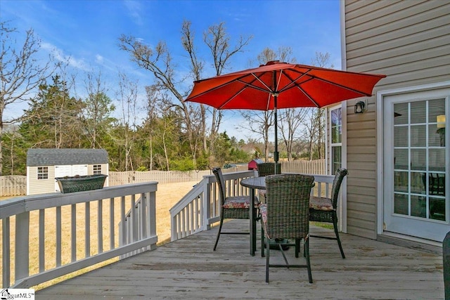 513 Rio Grande Pl, Simpsonville, SC 29680 - wooden deck featuring a storage shed, a fenced backyard, outdoor dining space, and an outdoor structure
