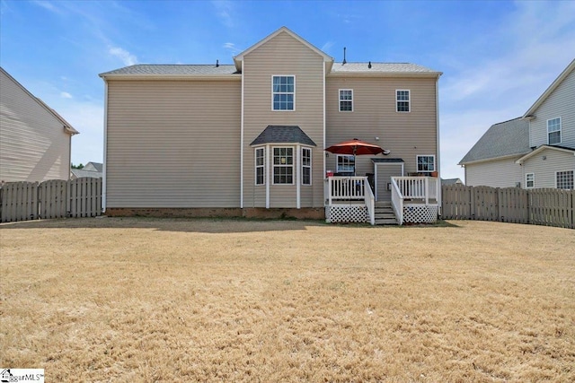 513 Rio Grande Pl, Simpsonville, SC 29680 - rear view of house with a deck, a fenced backyard, and a lawn