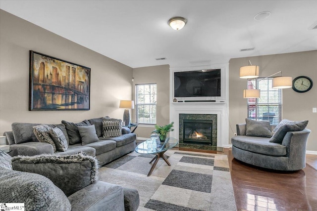 513 Rio Grande Pl, Simpsonville, SC 29680 - living room with a glass covered fireplace, visible vents, baseboards, and wood finished floors