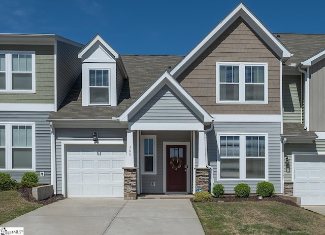 305 Albemarle Ln, Greer, SC 29650 - view of front of home with stone siding, concrete driveway, and an attached garage