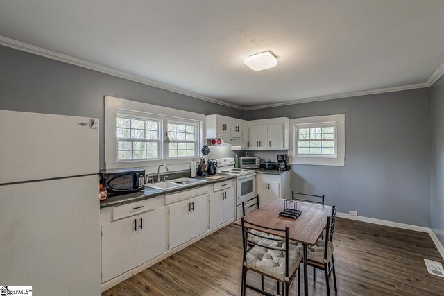123 Cobb St, Easley, SC 29640 - kitchen featuring white appliances, wood finished floors, ornamental molding, and a sink