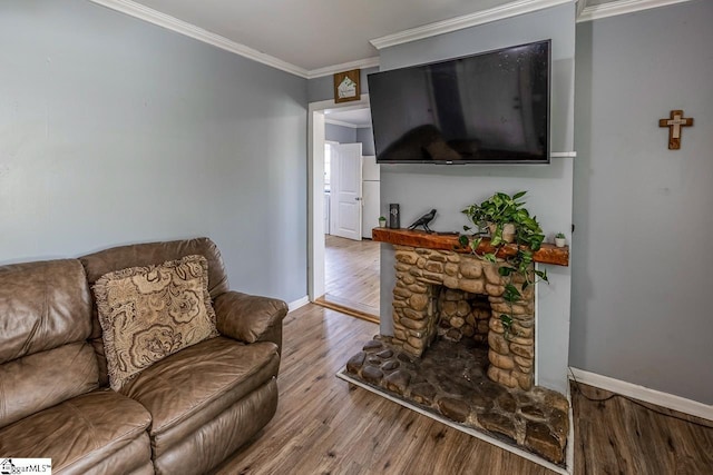 123 Cobb St, Easley, SC 29640 - living area with baseboards, a fireplace, wood finished floors, and ornamental molding