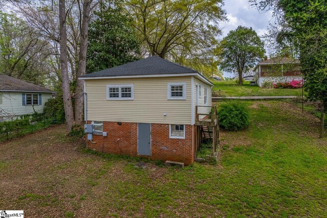 123 Cobb St, Easley, SC 29640 - rear view of house featuring brick siding, stairs, and a lawn