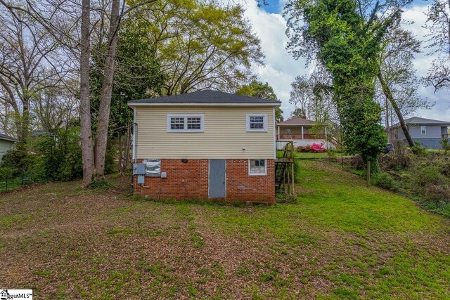 123 Cobb St, Easley, SC 29640 - back of property featuring brick siding, stairway, and a yard