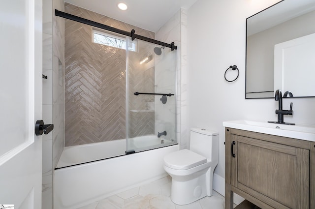 full bathroom featuring combined bath / shower with glass door, vanity, and toilet