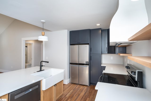 kitchen featuring recessed lighting, dishwasher, electric stove, wood finished floors, and stainless steel fridge