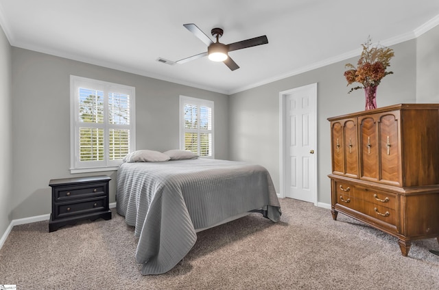 carpeted bedroom featuring baseboards, visible vents, ornamental molding, and a ceiling fan
