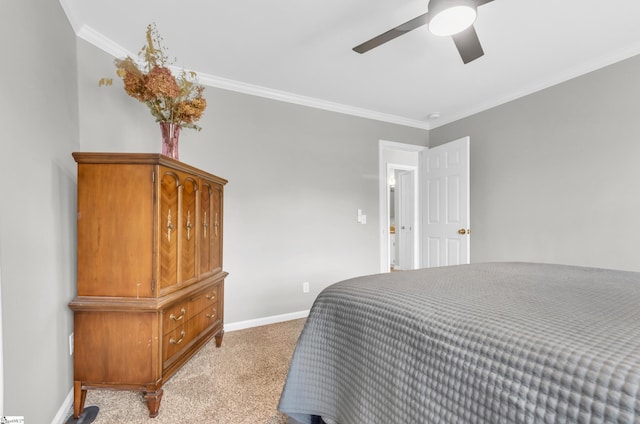 bedroom featuring a ceiling fan, ornamental molding, baseboards, and light colored carpet