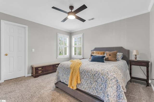 bedroom featuring ornamental molding, baseboards, visible vents, a ceiling fan, and light carpet
