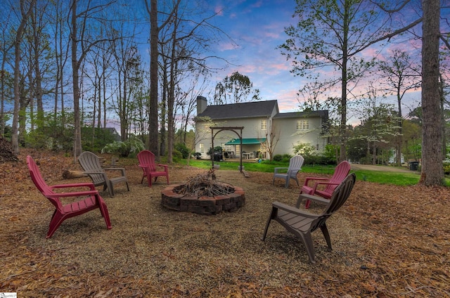 view of yard with an outdoor fire pit