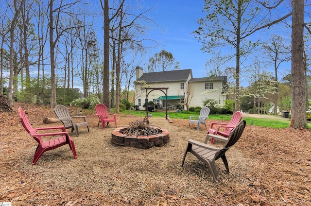 view of yard with a fire pit