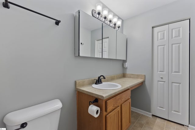 29 Parkgate Ct, Simpsonville, SC 29680 - bathroom with toilet, vanity, baseboards, and a closet