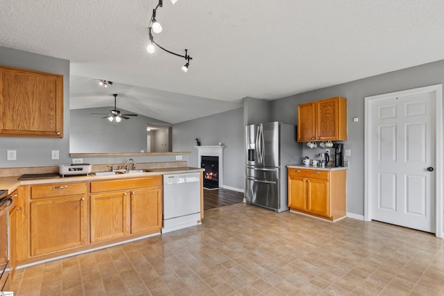 29 Parkgate Ct, Simpsonville, SC 29680 - kitchen with white dishwasher, stainless steel refrigerator with ice dispenser, a sink, a peninsula, and a ceiling fan