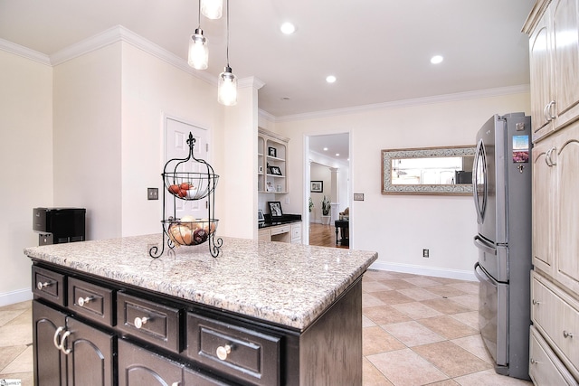 kitchen with baseboards, crown molding, recessed lighting, and freestanding refrigerator