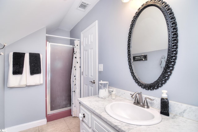 bathroom featuring tile patterned floors, vanity, a shower stall, lofted ceiling, and visible vents