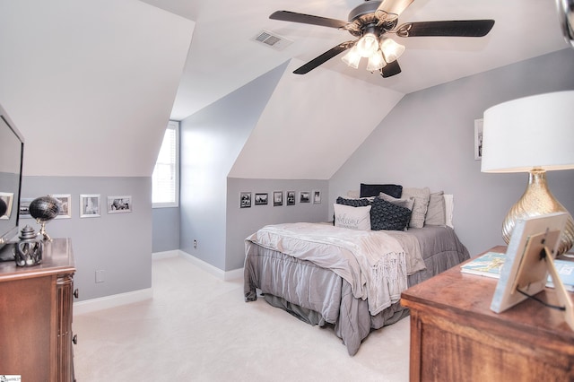 bedroom featuring visible vents, baseboards, ceiling fan, lofted ceiling, and light colored carpet