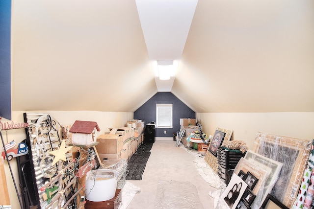 interior space with baseboards and lofted ceiling