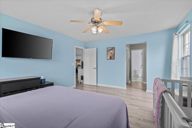 22 Kavanagh Ct, Greenville, SC 29611 - bedroom with connected bathroom, ceiling fan, baseboards, and light wood-type flooring