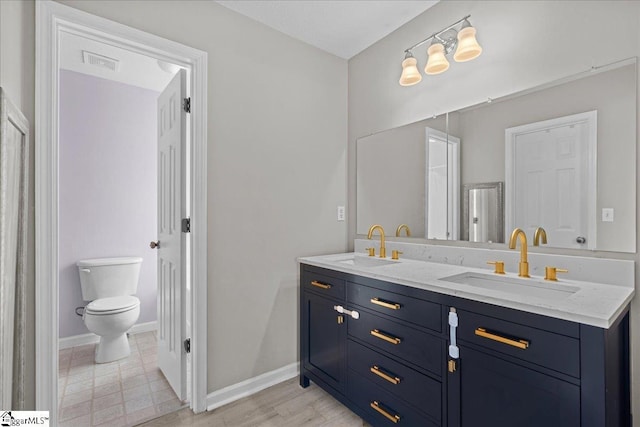 22 Kavanagh Ct, Greenville, SC 29611 - full bath with double vanity, visible vents, toilet, and a sink