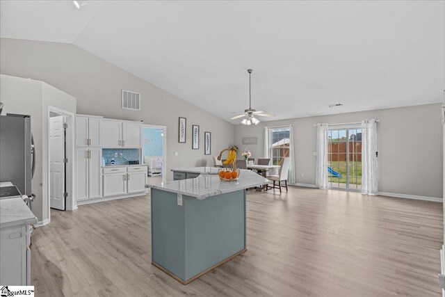 22 Kavanagh Ct, Greenville, SC 29611 - kitchen featuring visible vents, a ceiling fan, freestanding refrigerator, light wood-style flooring, and white cabinetry