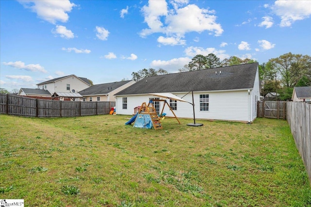 22 Kavanagh Ct, Greenville, SC 29611 - rear view of house with a fenced backyard, a yard, and a playground