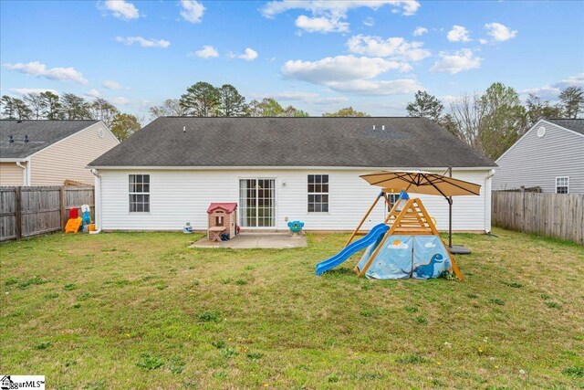 22 Kavanagh Ct, Greenville, SC 29611 - back of house with a fenced backyard, a patio area, a yard, and a playground