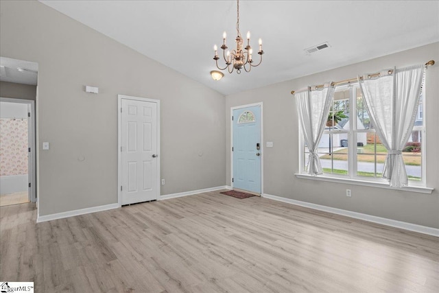 22 Kavanagh Ct, Greenville, SC 29611 - interior space with lofted ceiling, wood finished floors, visible vents, and a notable chandelier