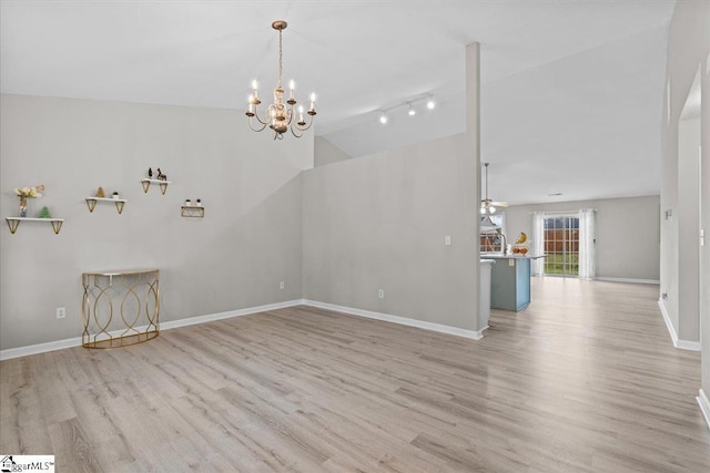 22 Kavanagh Ct, Greenville, SC 29611 - interior space featuring wood finished floors, baseboards, a sink, and an inviting chandelier
