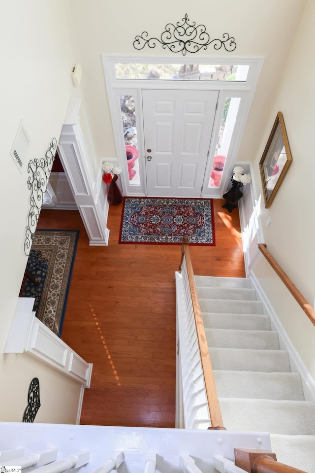entryway featuring stairs and wood finished floors
