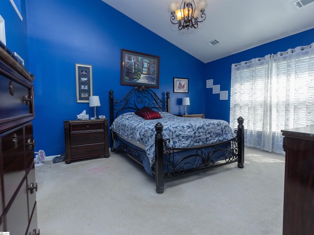 bedroom with carpet floors, a notable chandelier, vaulted ceiling, and visible vents