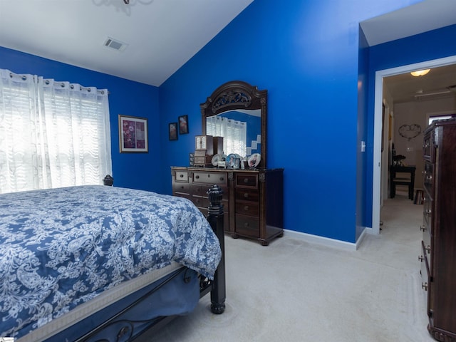 bedroom with baseboards, carpet, vaulted ceiling, and visible vents