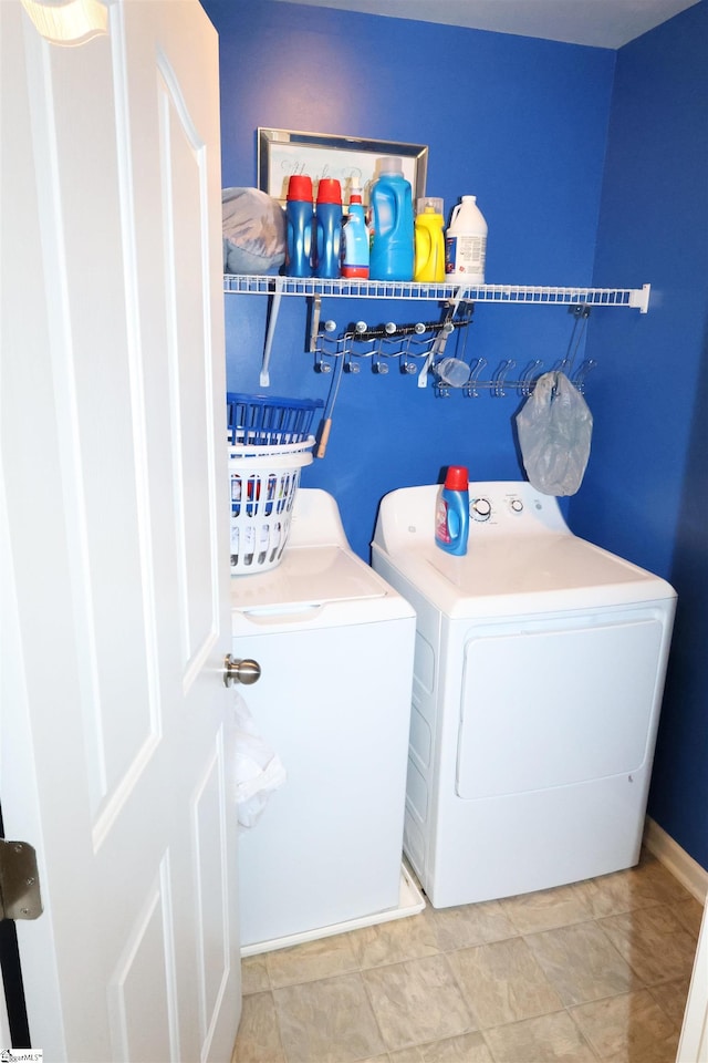 washroom with washer and dryer and laundry area
