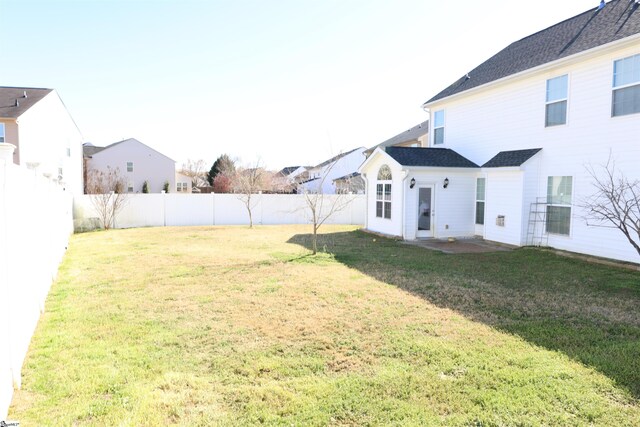 view of yard with a fenced backyard