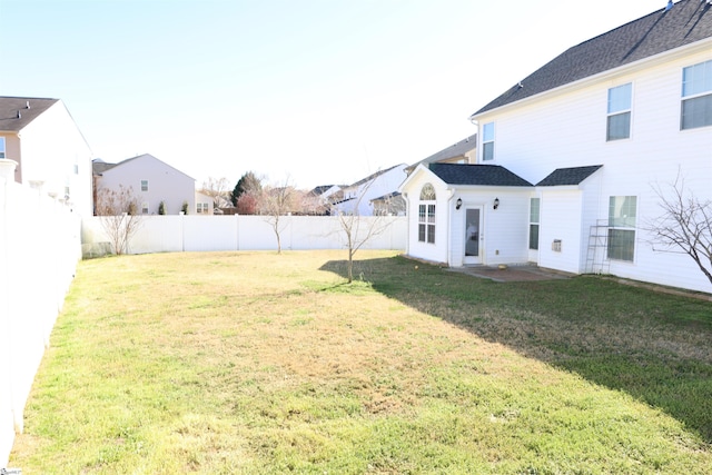 view of yard with a fenced backyard