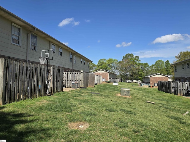 view of yard with cooling unit and fence